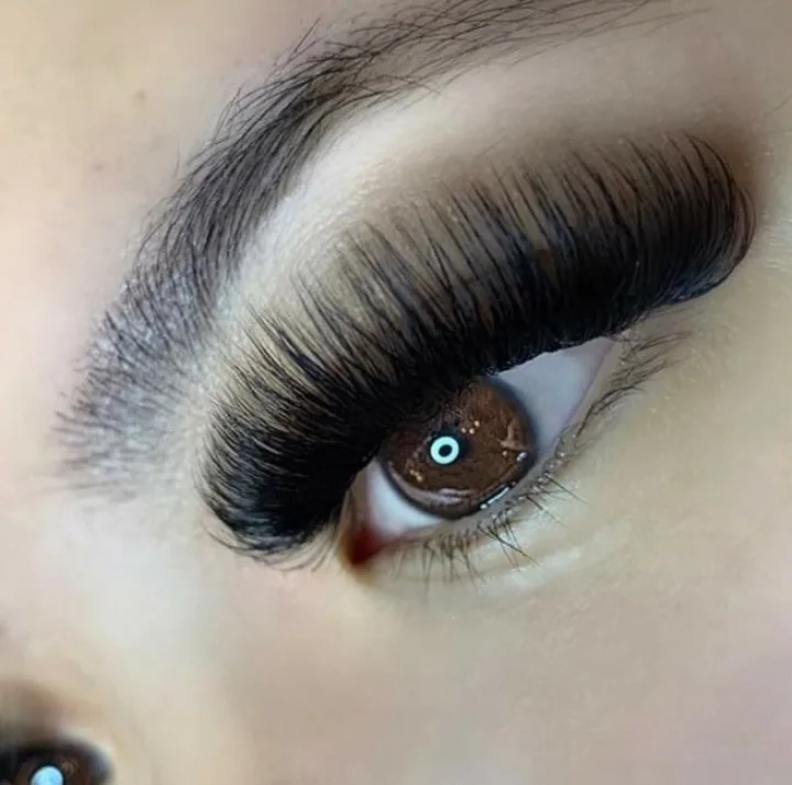 Close-up of a dense, dramatic mega-volume lash extension set